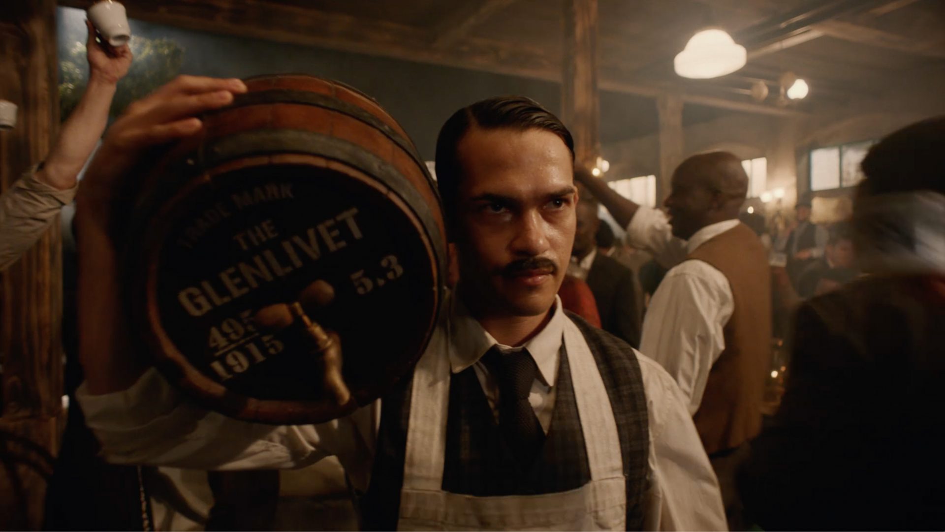 Man carrying a Glenlivet barrel on his shoulders for "Original by Tradition" TV ad campaign by CPB London